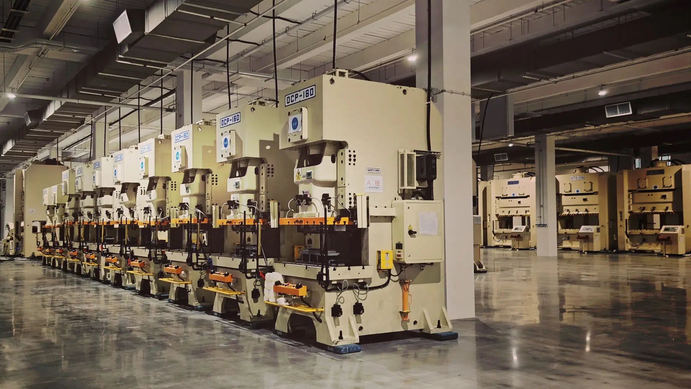 A line of power presses in an empty press shop